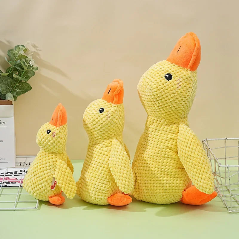 Dog sleeping with a dog hug duck toys to relieve boredom of little yellow duck pet interactive plush doll pet supplies ﻿