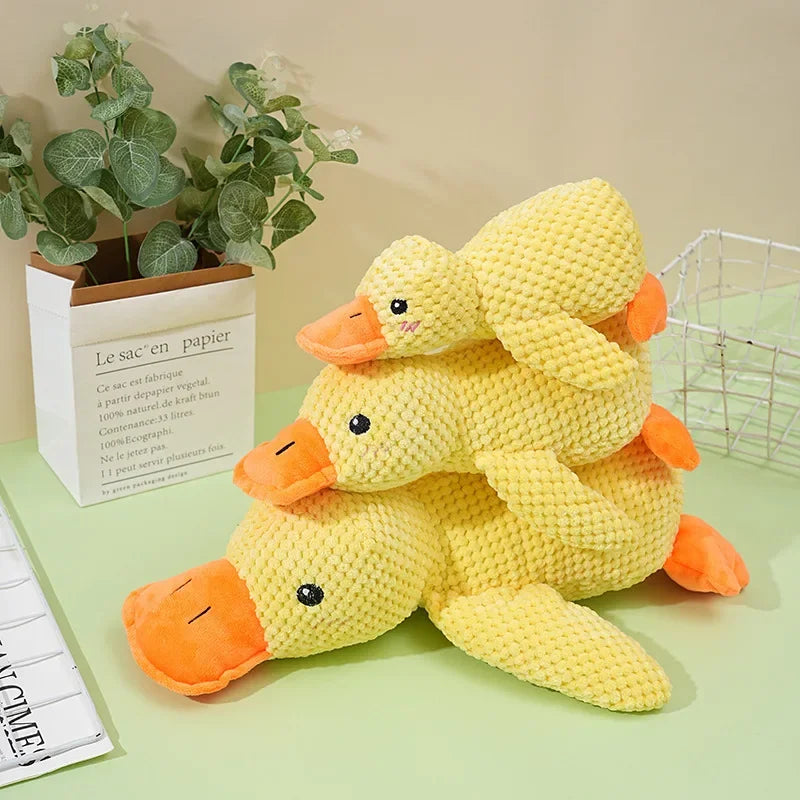 Dog sleeping with a dog hug duck toys to relieve boredom of little yellow duck pet interactive plush doll pet supplies ﻿
