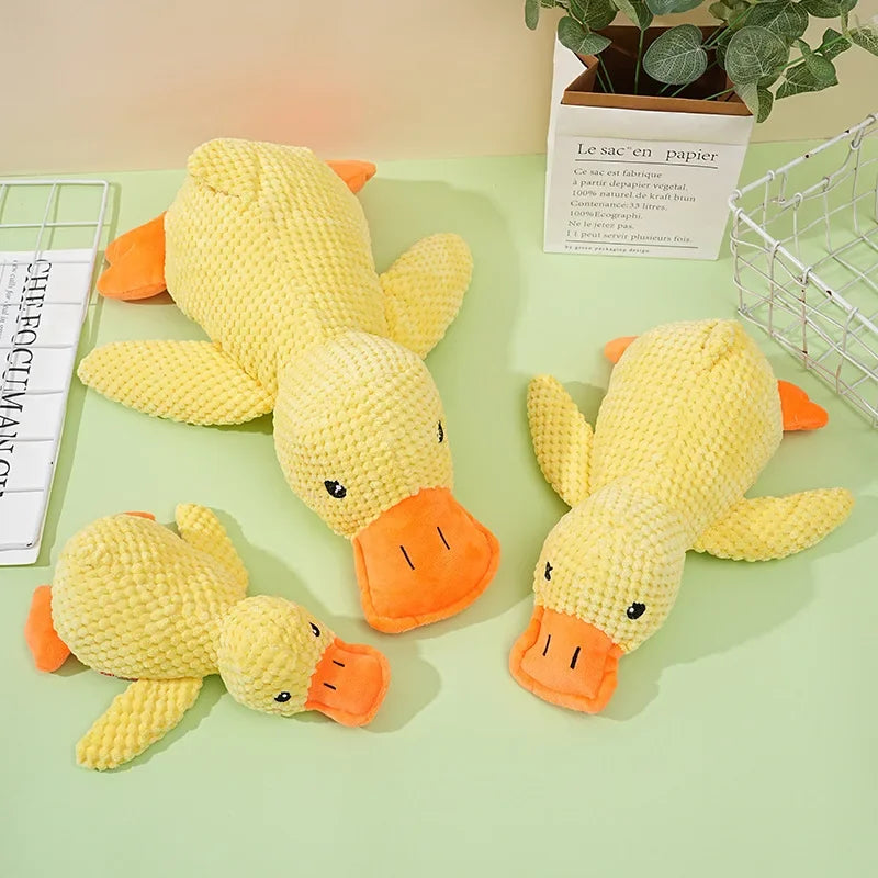 Dog sleeping with a dog hug duck toys to relieve boredom of little yellow duck pet interactive plush doll pet supplies ﻿