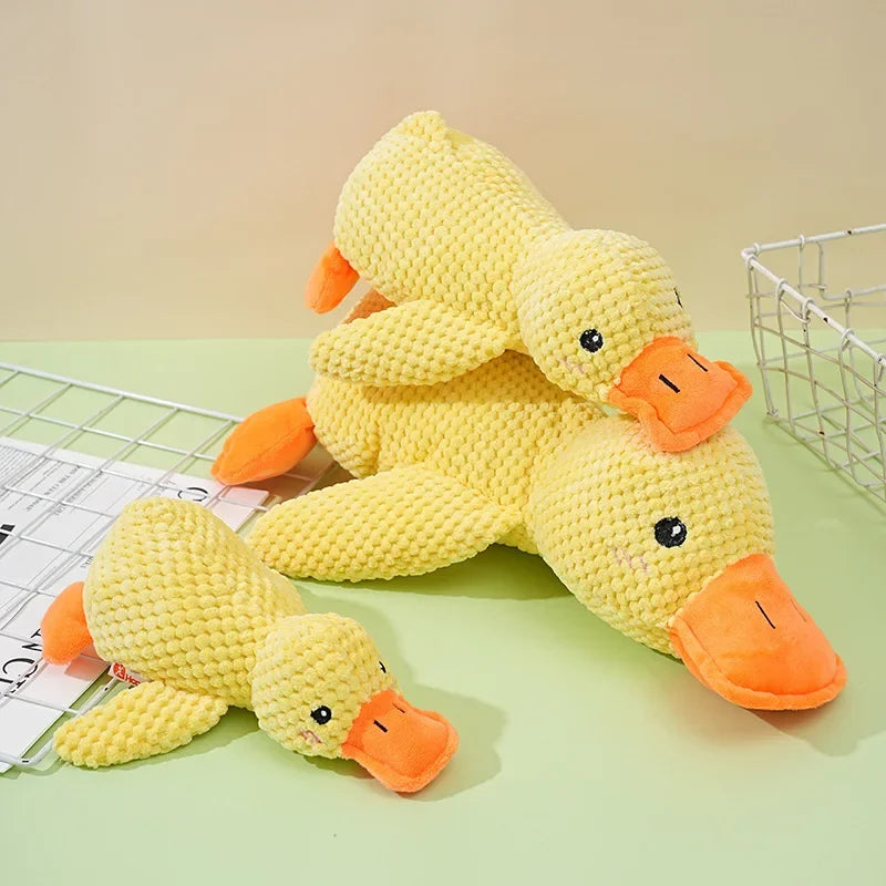 Dog sleeping with a dog hug duck toys to relieve boredom of little yellow duck pet interactive plush doll pet supplies ﻿